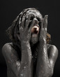 © Syda Productions - picture of crying dirty woman over black