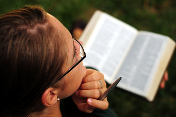 Student reading in a public park