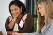 © Rob - Two Women Working On A Computer Together