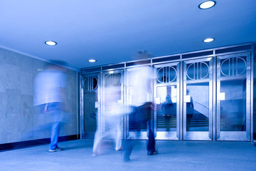 People mooving in hall corridor