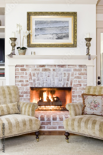 chairs in front of fireplace