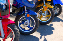 Closeup Of Row Of Scooter Wheels