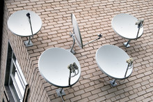 Five Satellite Antennas On The Home Front