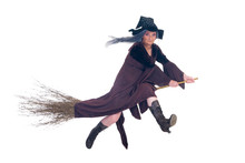 Middle Aged Halloween Witch Flying On Broom.