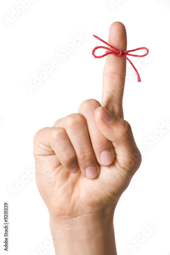 Fotografía Right hand with reminder string tied to index finger