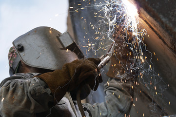 a metal welder busy at work