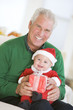 © Monkey Business - Grandfather With Baby In Santa Outfit