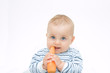 © Renata Osinska - little, cute baby boy eating fresh carrot, on white