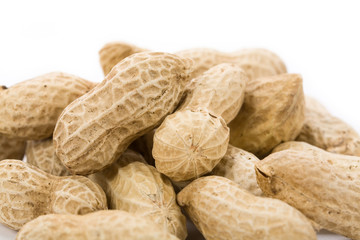 Wall Mural - Peanuts with white background, close up