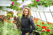 Beautiful woman with in the greenhouse.