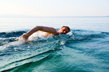 Swimming Man In Clear Ocean Water
