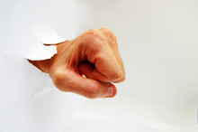 Man's Hand In A Fist Punching Thru A Hole