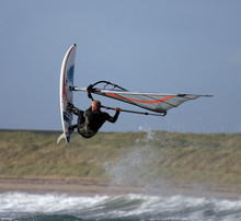 Windsurfers Jumping The Waves At Rhosneiger