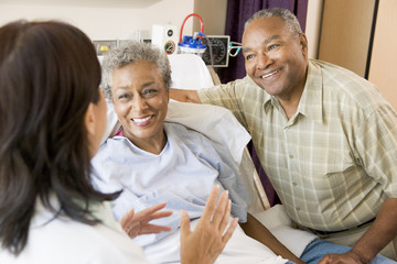 Nurse Talking To Senior Couple