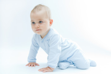 Sticker - crawling baby boy on bright background