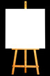 Photo of canvas and easel isolated in black background