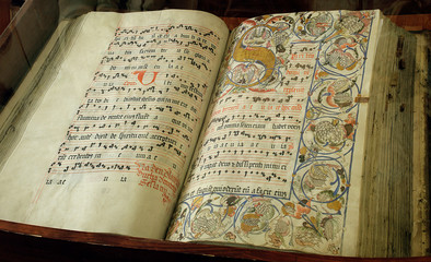 medieval religious book with dots and illumination