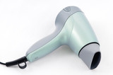 Green hair-dryer on the white background.