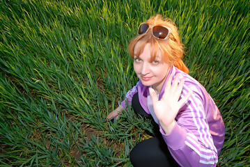 portrait of  woman on  background of green grass