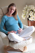 © endostock - relaxed pregnant woman on chair