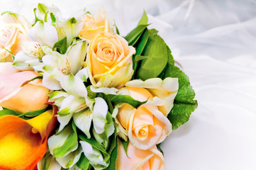 Wall Mural - wedding bouquet of fresh flowers against white dress