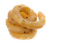 Isolated Macro Image Of Curly French Fries.