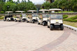 A row of empty golf carts waiting for golfers at a country club