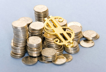 small silver coins with golden dollar sign