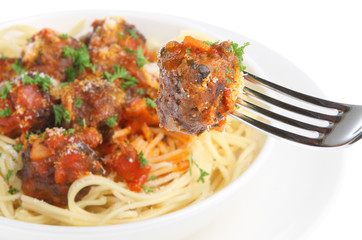 Sticker - Italian meatballs with spaghetti. Selective focus on fork.