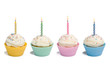 Four cupcakes with candle on white background