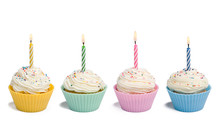 Four Cupcakes With Candle On White Background