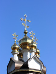 Domes of orthodox church on a blue sky background. Russia