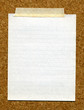 High resolution piece of writing paper stuck to a cork board.
