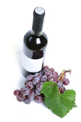 Wall Mural - Close up of a bottle of wine and grapes