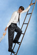 © pressmaster - Image of professional going upwards the ladder