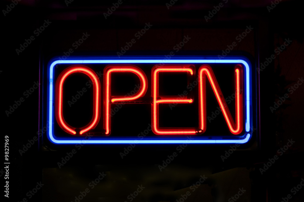 A neon OPEN sign glowing red in the window of a restaurant. - obrazy, fototapety, plakaty 