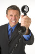 Businessman Holding Telephone