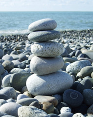 Wall Mural - stack of a pebble stones on a beach