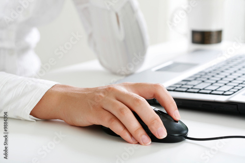 Fotografie, Obraz Image of female hand touching computer mouse
