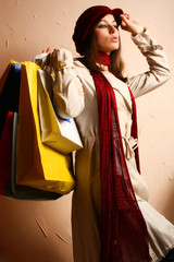 Wall Mural - Portrait of young beautiful women with her shopping bags