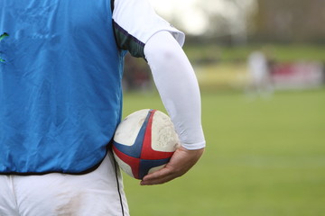 Sticker - rugby player holding a ball