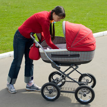 Young Woman With Red Baby Carriage