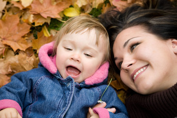 Canvas Print - mother and daughter playing in park