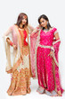 Two beautiful Bangali brides in colorful dresses, isolated
