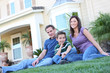 © Stephen Coburn - A happy family having fun outdoors in front of their home