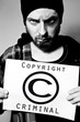 © dundanim - Man arrested for violating copyright laws