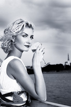 Beautiful Blond Girl Drinks Champagne Near The River
