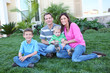 © Stephen Coburn - A happy family having fun outdoors in front of their home