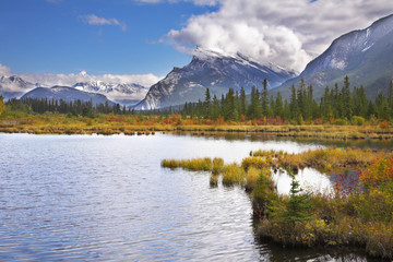 Sticker - The first days of autumn on lake in mountains of Canada.