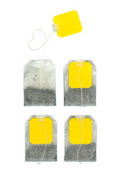 Wall Mural - Four teabags on white background